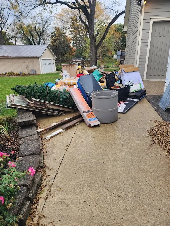 Dumpster being loaded with debris for 30 Yard Dumpster Rental in Dyersburg
